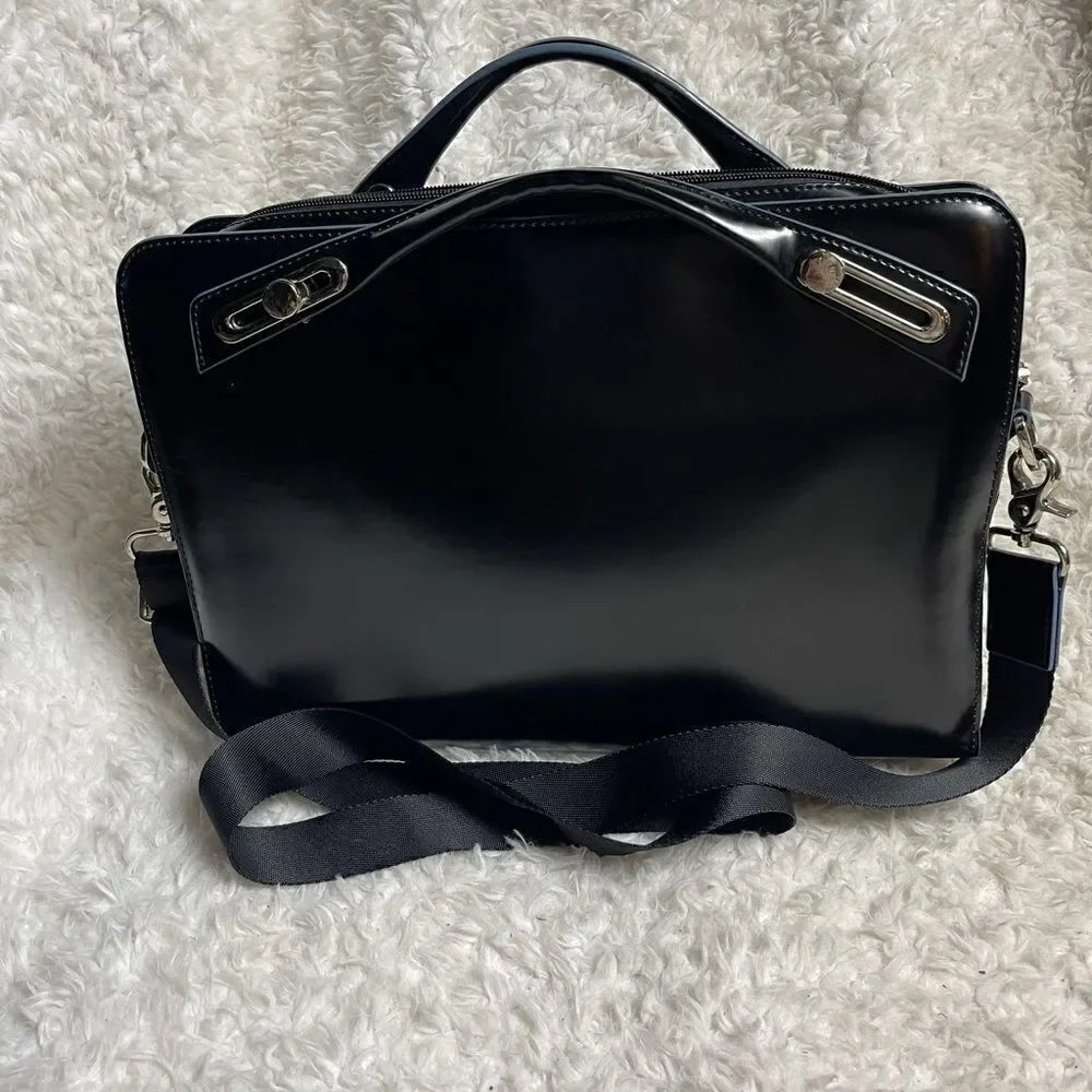 Abbi New York Laptop/Briefcase Carrier Black leather inside padded fabric.
